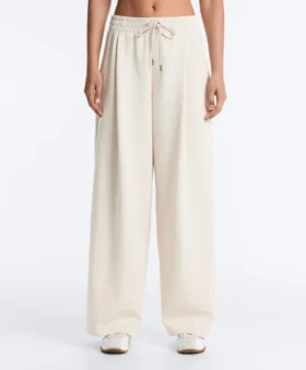 Broek met wijde pijpen, piqué en plooien, met katoen Broek met wijde pijpen, piqué en plooien, met katoen