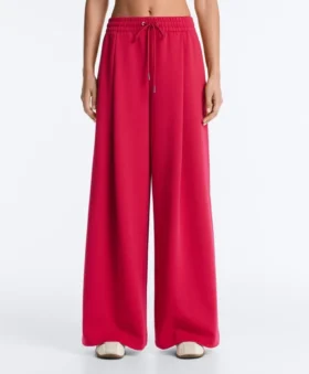 Broek met wijde pijpen, piqué en plooien, met katoen Broek met wijde pijpen, piqué en plooien, met katoen