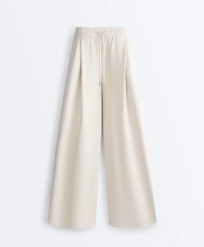 Broek met wijde pijpen, piqué en plooien, met katoen Broek met wijde pijpen, piqué en plooien, met katoen